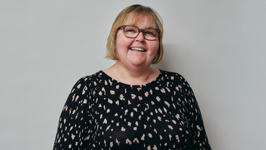 A portrait image of Alison, Trust Relationship Manager (South) of Mencap Trust Company, smiling at the camera. 