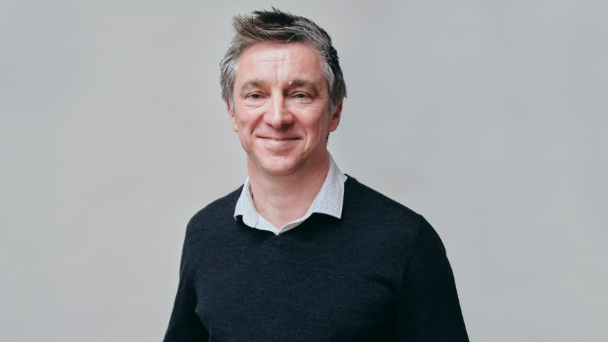 A portrait image of Neville, Trust Accountant for Mencap Trust Company, smiling at the camera. 