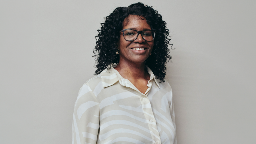 A portrait image of Valerie, New Trust Development Manager for Mencap Trust Company, smiling at the camera. 