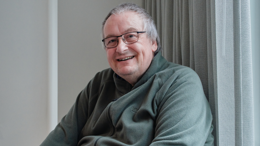 A professional headshot of David Smith who is smiling into the camera.